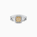 The Canare 14K Two-Tone Gold Yellow Diamond Ring Set features a cushion-cut yellow center stone with a halo of white diamonds and a split shank band adorned with more diamonds, showcasing the signature Effy Canare style.