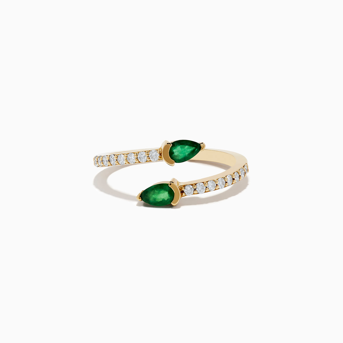 The 14K Yellow Gold Emerald and Diamond Bypass Ring showcases two pear-shaped emeralds on an open gold band accented by round white diamonds, elegantly displayed on a white background.
