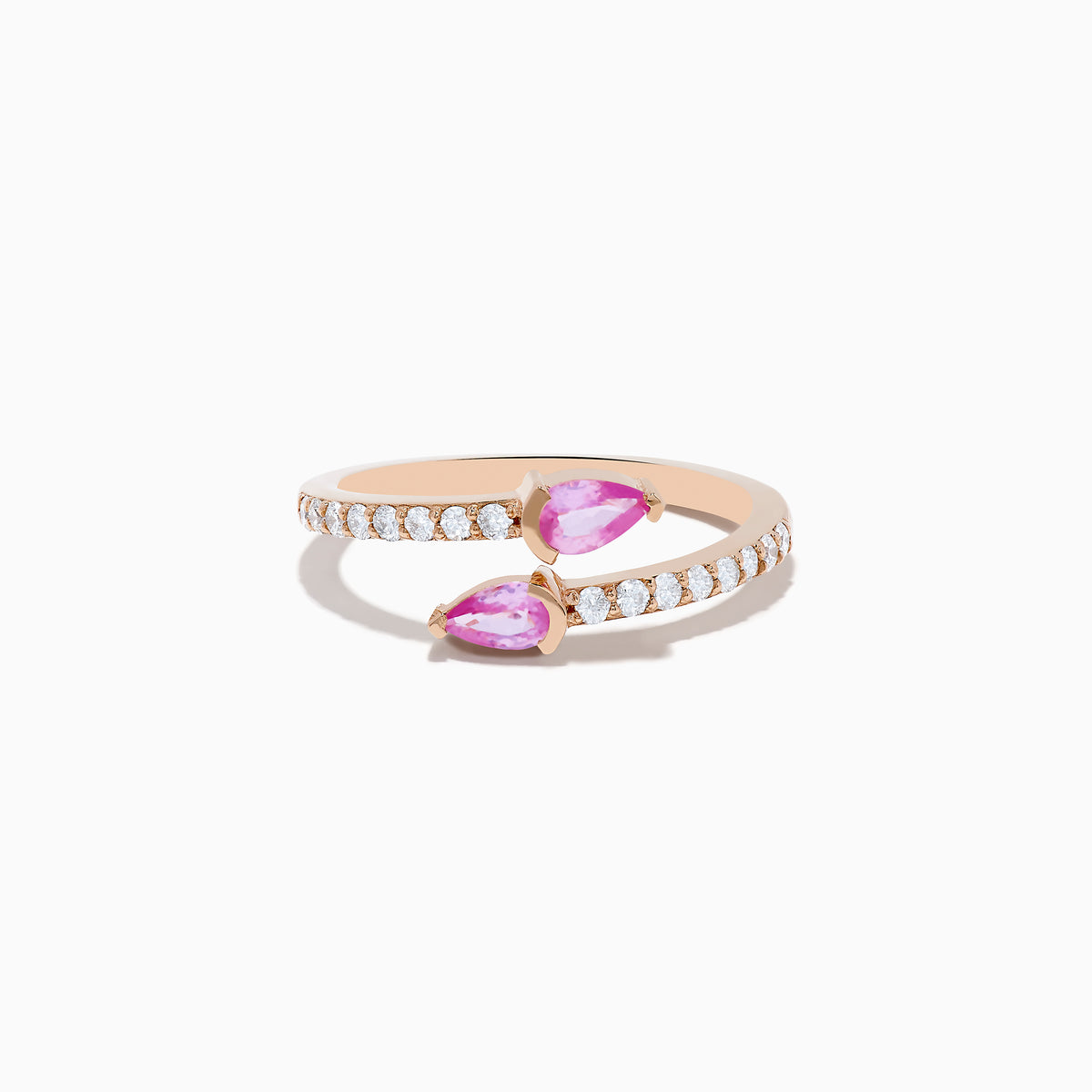 The 14K Rose Gold Pink Sapphire and Diamond Bypass Ring features two pear-shaped pink sapphires at each end and round white diamonds along the band, shown on a white background.