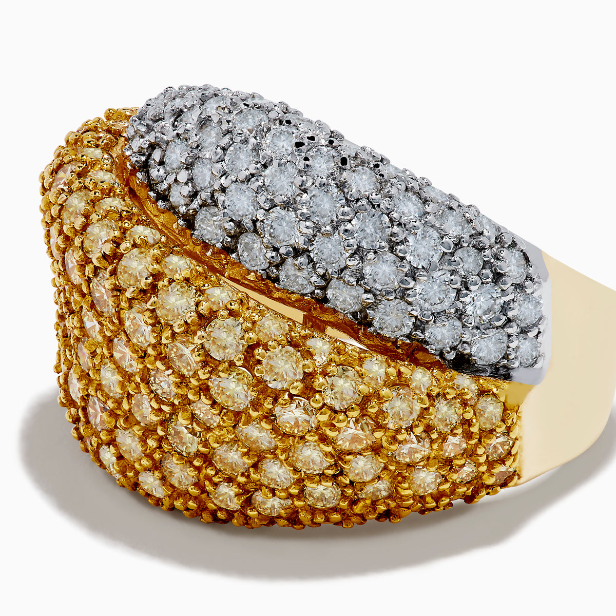 The Canare 14K Yellow Gold White and Yellow Diamond Statement Ring showcases two overlapping bands—one with white diamonds, one with yellow diamonds—in a textured pavé setting on radiant yellow gold.