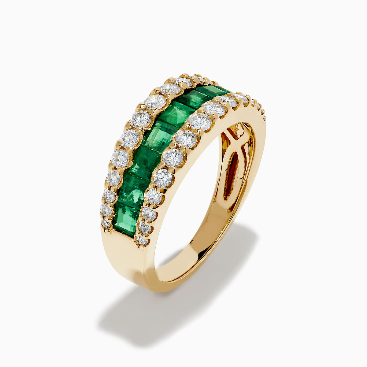 The Brasilica 14K Yellow Gold Emerald and Diamond Wide Band Ring features a symmetrical design with two rows of round diamonds framing horizontally set rectangular green emeralds, offering timeless sophistication.