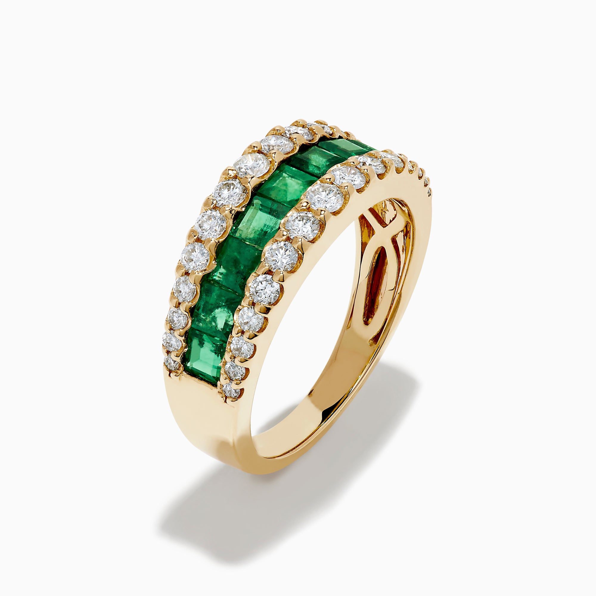 The Brasilica 14K Yellow Gold Emerald and Diamond Wide Band Ring features a symmetrical design with two rows of round diamonds framing horizontally set rectangular green emeralds, offering timeless sophistication.