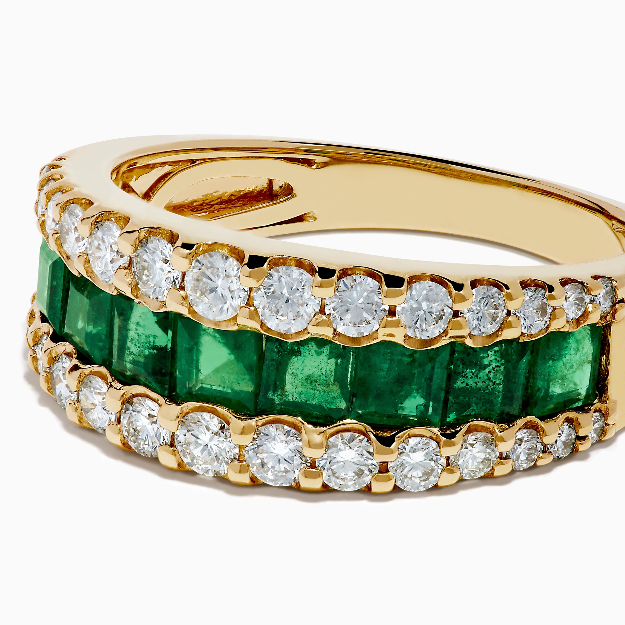 The Brasilica 14K Yellow Gold Emerald and Diamond Wide Band Ring features a symmetrical design with two rows of round diamonds framing horizontally set rectangular green emeralds, offering timeless sophistication.