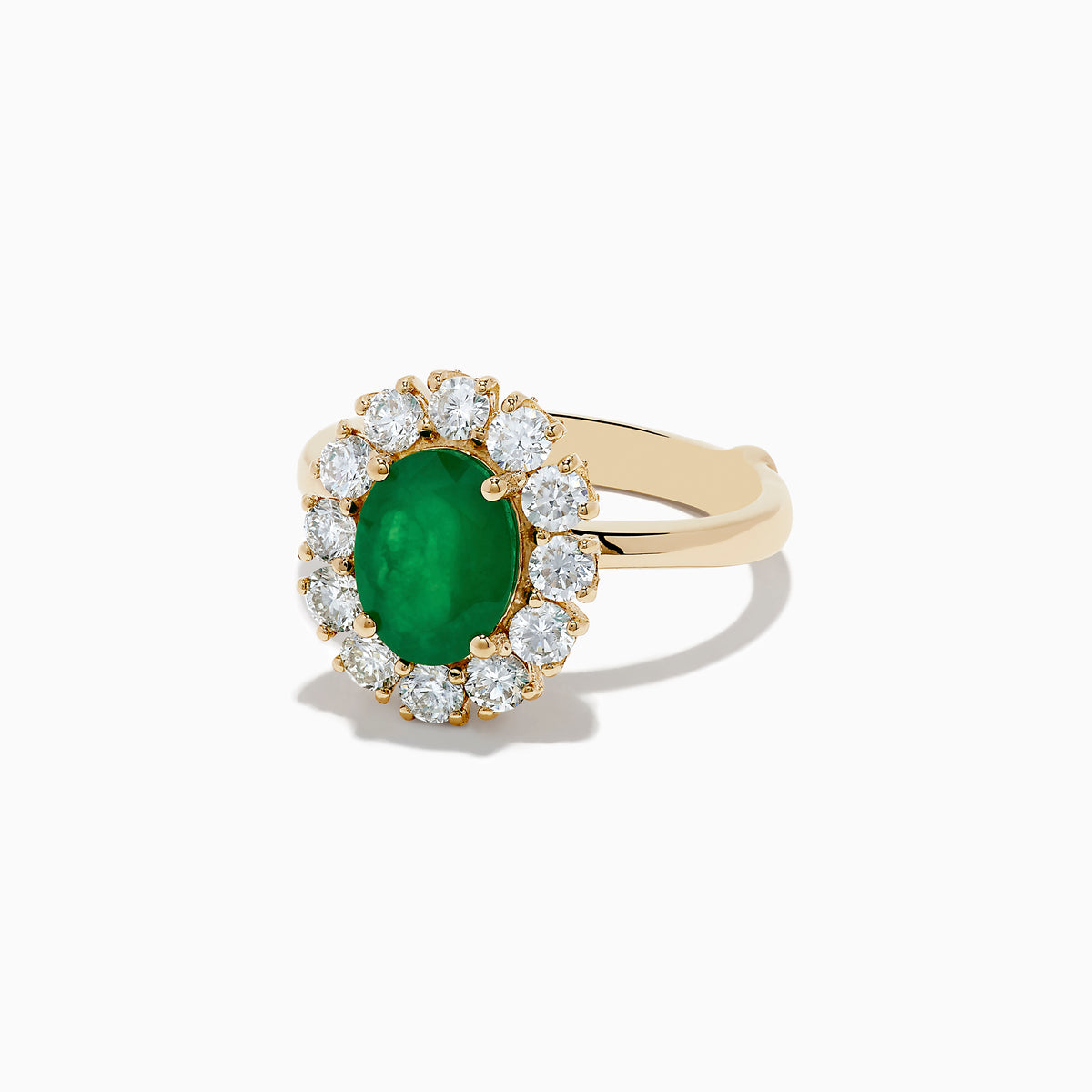 The 14K Yellow Gold Emerald and Diamond Ring showcases an oval emerald center accented by a halo of round white diamonds, displayed against a white background.