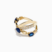 The Royal Bleu 14K Yellow Gold Sapphire and Diamond Criss Cross Chain Link Ring features three oval sapphires and rows of white diamonds along interwoven bands, shown on a white background.