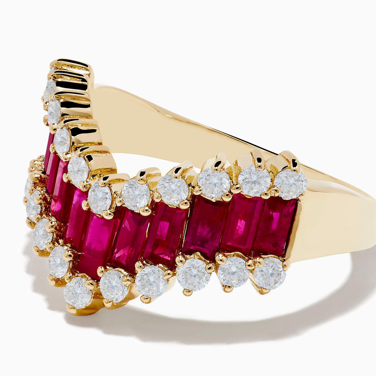 The 14K Yellow Gold Ruby and Diamond Chevron Ring features a V-shaped design with alternating rectangular rubies and round white diamonds, set against a plain white background.