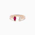 The Ruby Royale 14K Rose Gold Ruby and Diamond Toi Et Moi Ring features an open band with a marquise-cut ruby and emerald-cut diamond, shown against a white background.