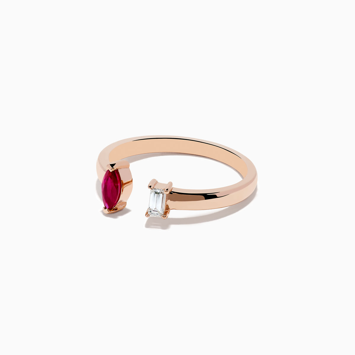 The Ruby Royale 14K Rose Gold Ruby and Diamond Toi Et Moi Ring features an open band with a marquise-cut ruby and emerald-cut diamond, shown against a white background.