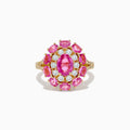 The 14K Yellow Gold Pink Sapphire and Diamond Ring features a large oval pink sapphire center, haloed by round diamonds and pink gemstones, with intricate band detailing.