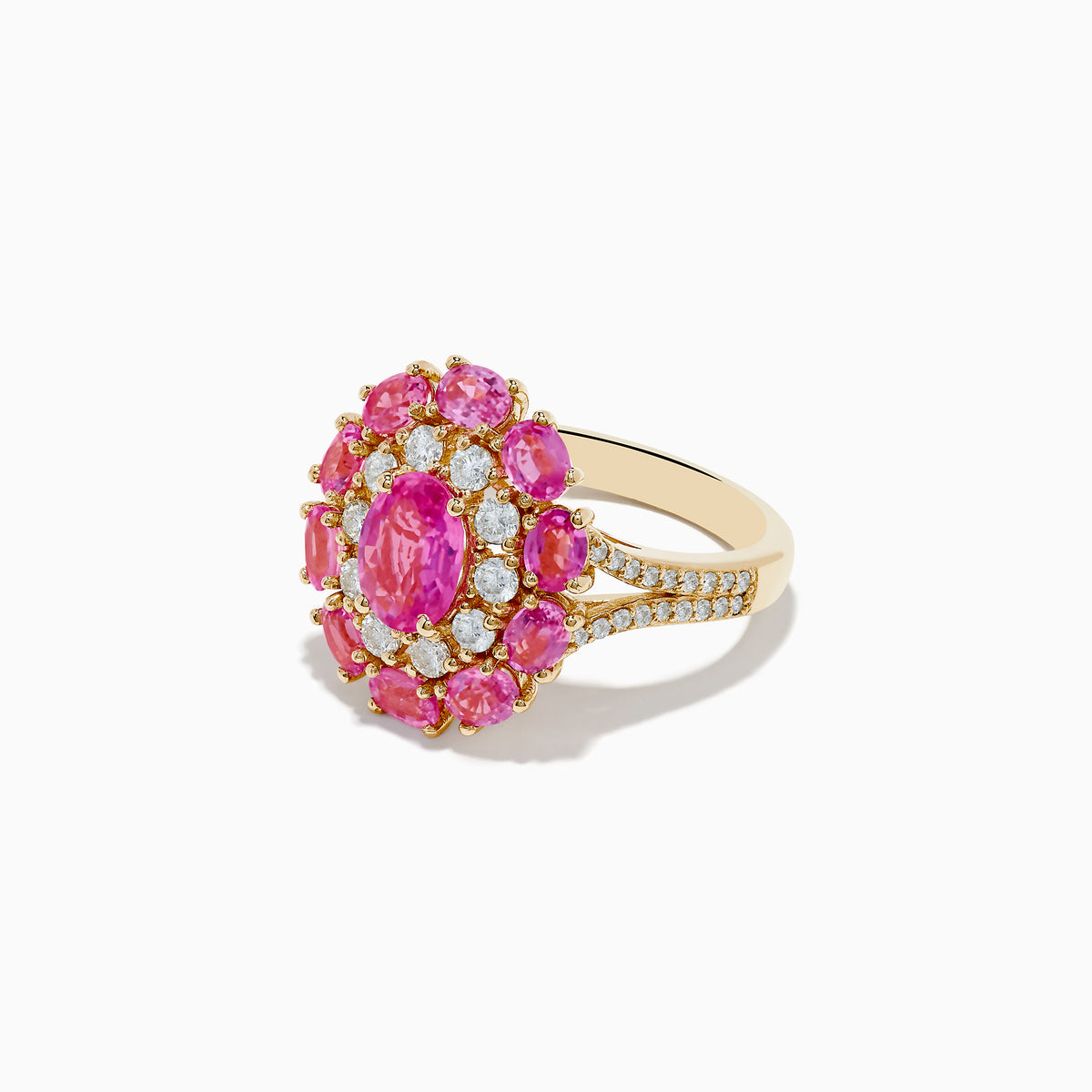 The 14K Yellow Gold Pink Sapphire and Diamond Ring features a large oval pink sapphire center, haloed by round diamonds and pink gemstones, with intricate band detailing.