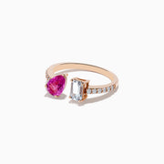 The 14K Gold Diamond, Pink and White Sapphire Toi Et Moi Ring features a pear-shaped pink sapphire, an emerald-cut white sapphire, and sparkling diamonds along the modern band.