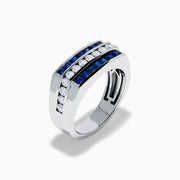 The Men's 14K White Gold Blue Sapphire and Diamond Channel Set Ring showcases a central row of round white diamonds bordered by two rows of square blue sapphires in a sleek, symmetrical design.