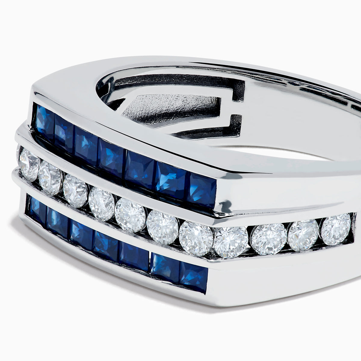 The Men's 14K White Gold Blue Sapphire and Diamond Channel Set Ring showcases a central row of round white diamonds bordered by two rows of square blue sapphires in a sleek, symmetrical design.