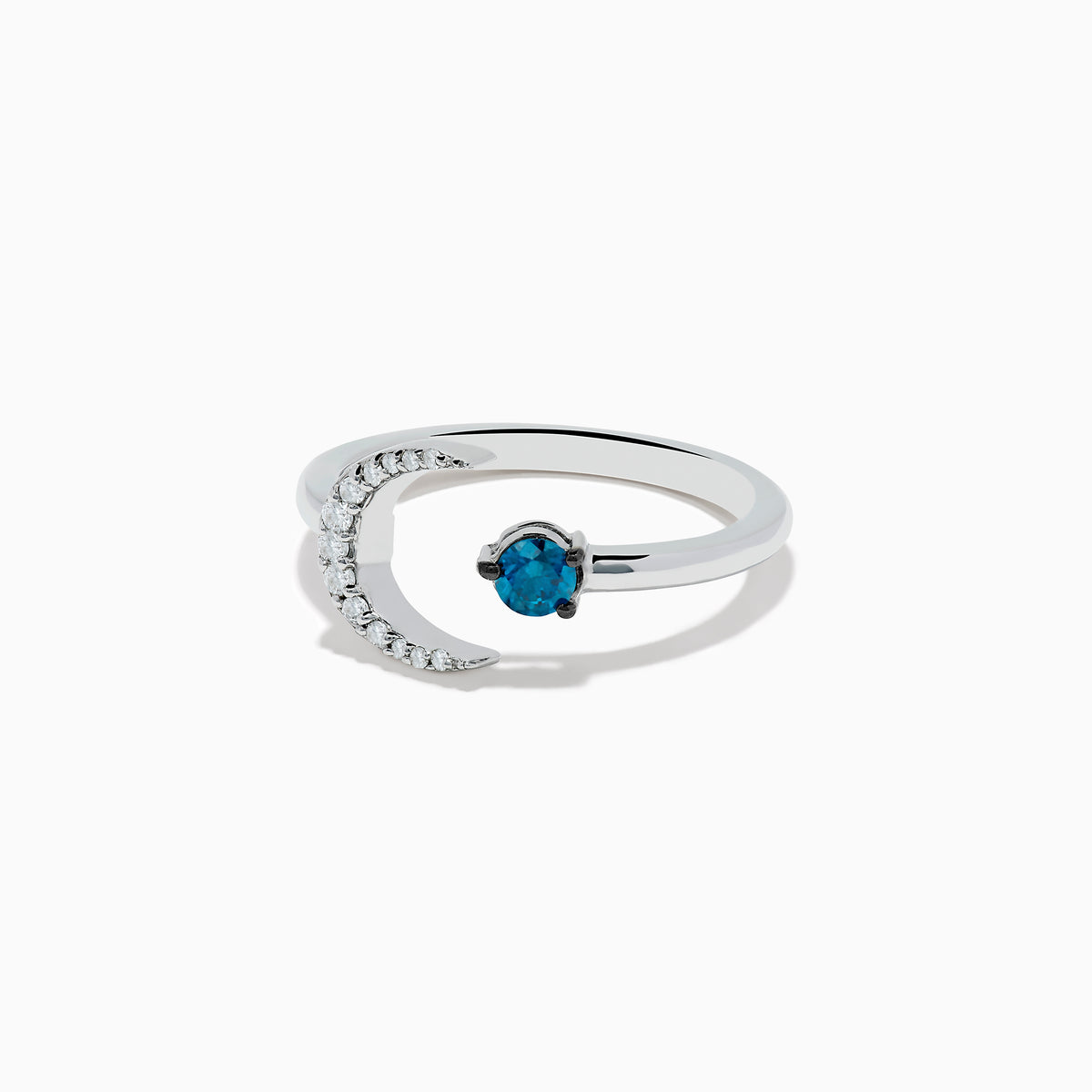 The Bella Bleu 14K White Gold White and Blue Diamond Crescent Moon Ring features a crescent moon with clear stones and an open band showcasing a round blue diamond opposite the moon.