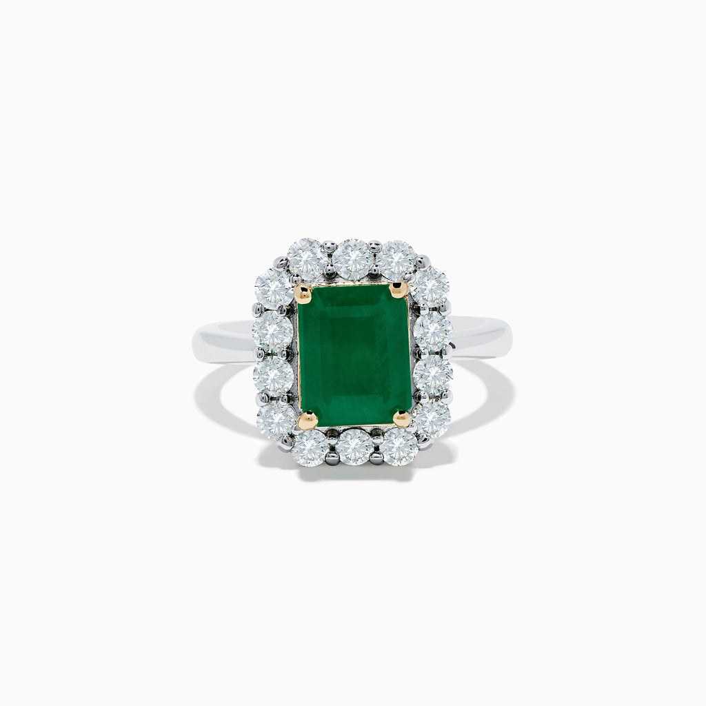 The Brasilica 14K Two-Tone Gold Emerald and Diamond Ring features a rectangular emerald, a halo of round diamonds, and silver band accented with gold prongs at each corner for a striking look.