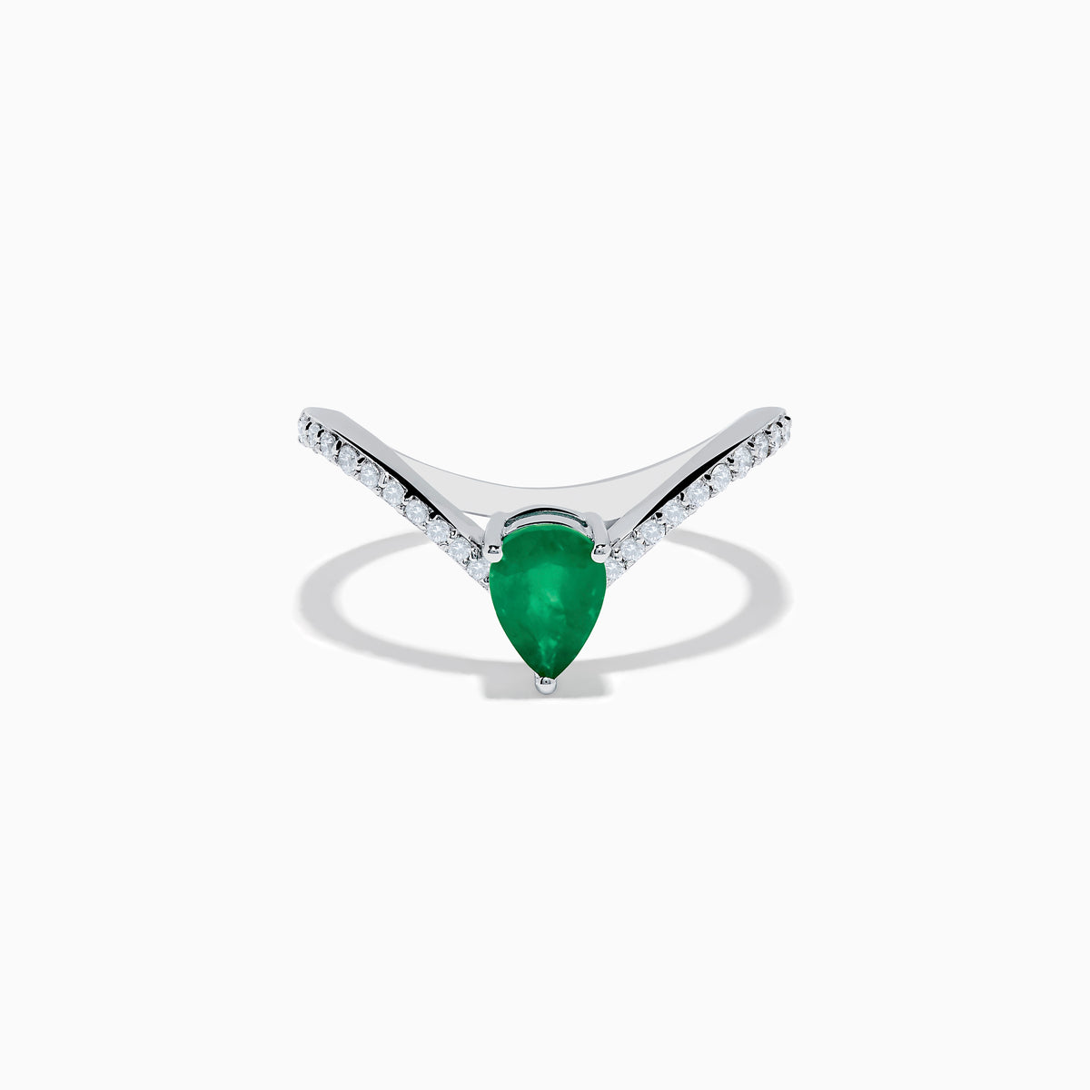 The Brasilica 14K White Gold Emerald and Diamond Ring has a pear-shaped green emerald center and sparkling round diamonds on a V-shaped band, shown on a plain white background.