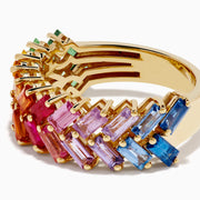 The Watercolors 14K Yellow Gold Multi Sapphire Two Row Baguette Band features a zigzag design with sapphires in a rainbow gradient of green, yellow, orange, red, pink, and blue.