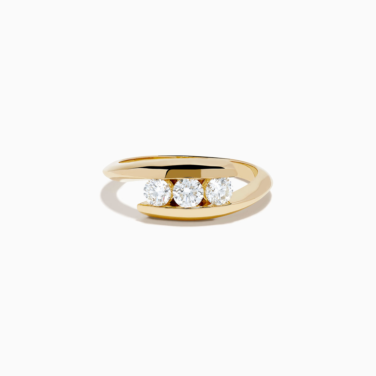 The D'Oro 14K Yellow Gold Diamond Bypass Ring features three round white diamonds in a row and a modern, open, curved band design, shown on a white background.