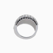 The Ruby Royale 14K White Gold Ruby and Diamond Wide Band showcases a central row of rectangular rubies flanked by sparkling round diamonds, all elegantly set in white gold against a plain white background.