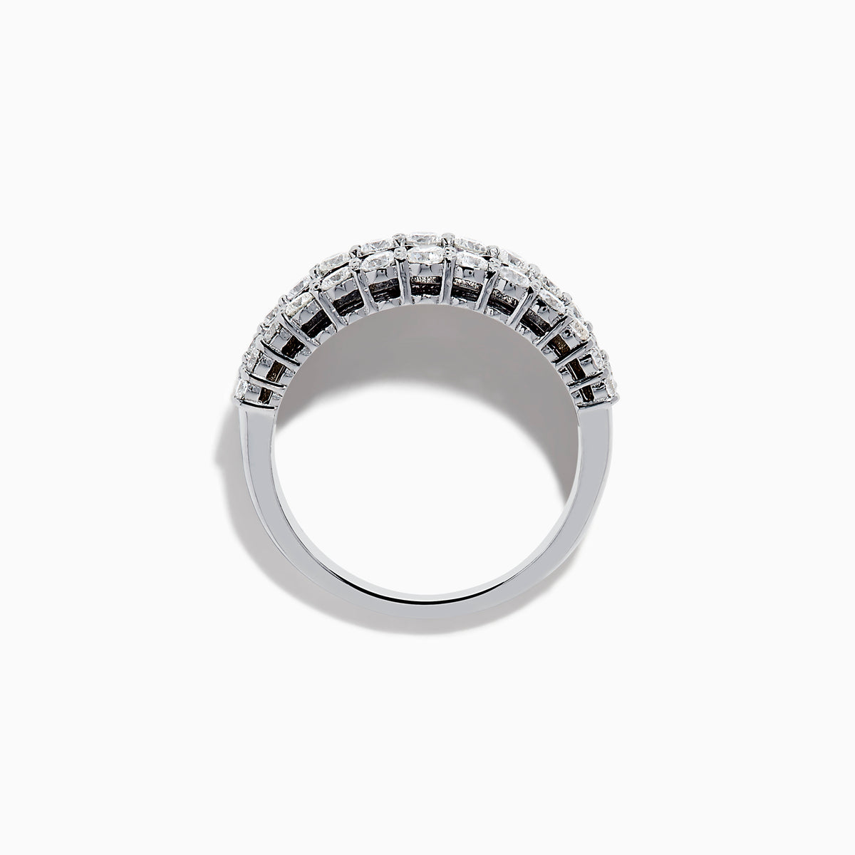 The Ruby Royale 14K White Gold Ruby and Diamond Wide Band showcases a central row of rectangular rubies flanked by sparkling round diamonds, all elegantly set in white gold against a plain white background.