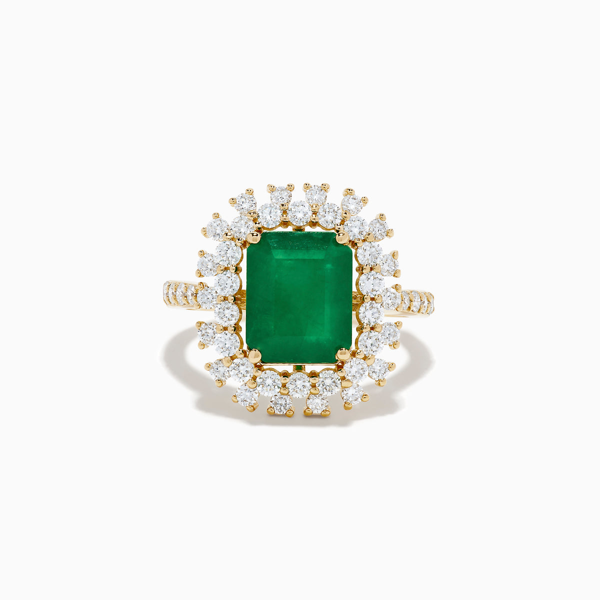 The 14K Yellow Gold Emerald and Diamond Halo Cocktail Ring showcases a large rectangular green emerald at the center, surrounded by a sparkling double halo of round white diamonds.
