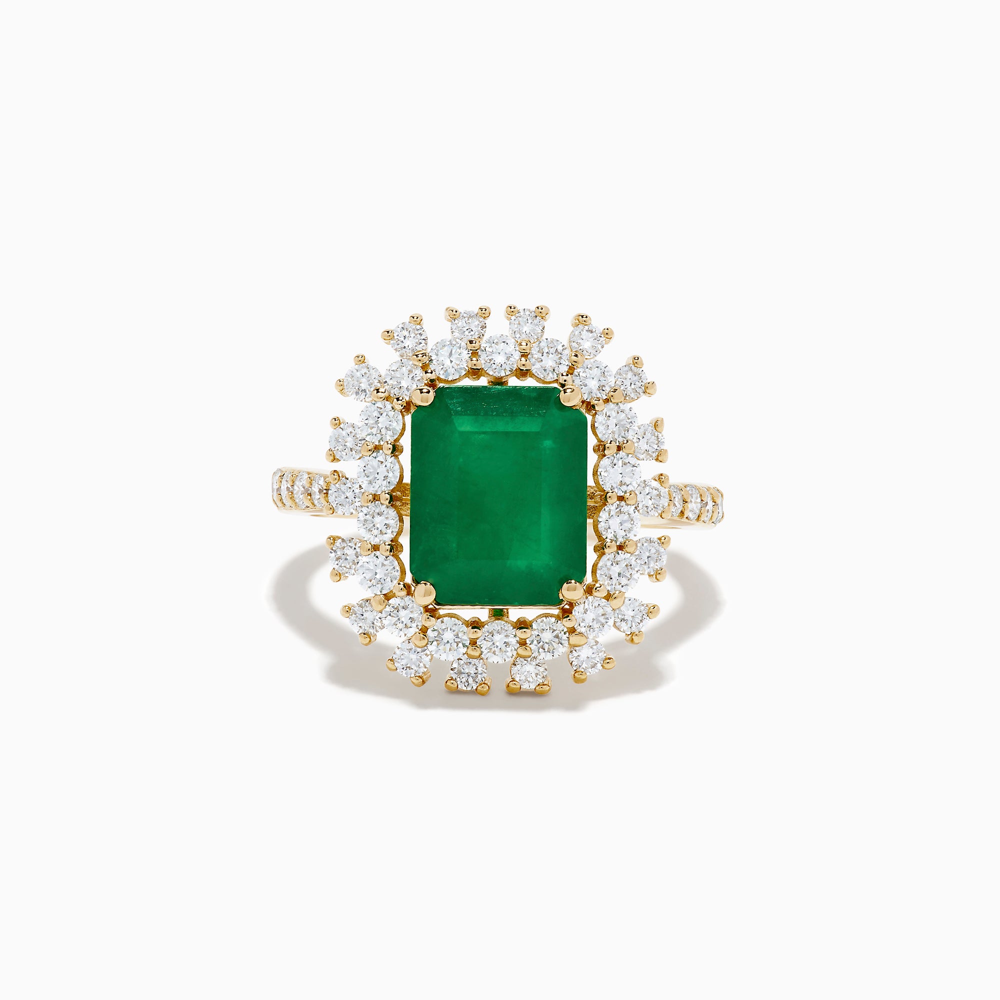The 14K Yellow Gold Emerald and Diamond Halo Cocktail Ring showcases a large rectangular green emerald at the center, surrounded by a sparkling double halo of round white diamonds.