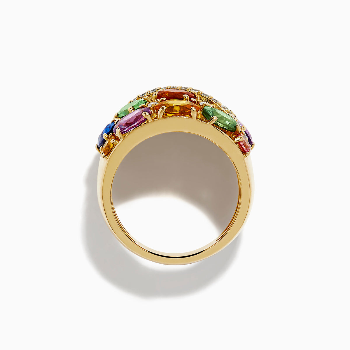 Introducing the 14K Yellow Gold Multi Sapphire and Diamond Statement Ring: This bold ring showcases a wide band of 14K yellow gold, highlighted by luminous oval sapphires in green, orange, pink, blue, and purple. A diagonal row of sparkling white diamonds crosses the center, creating a dazzling focal point that makes this sapphire ring an eye-catching and colorful addition to any jewelry collection.