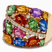 Introducing the 14K Yellow Gold Multi Sapphire and Diamond Statement Ring: This bold ring showcases a wide band of 14K yellow gold, highlighted by luminous oval sapphires in green, orange, pink, blue, and purple. A diagonal row of sparkling white diamonds crosses the center, creating a dazzling focal point that makes this sapphire ring an eye-catching and colorful addition to any jewelry collection.