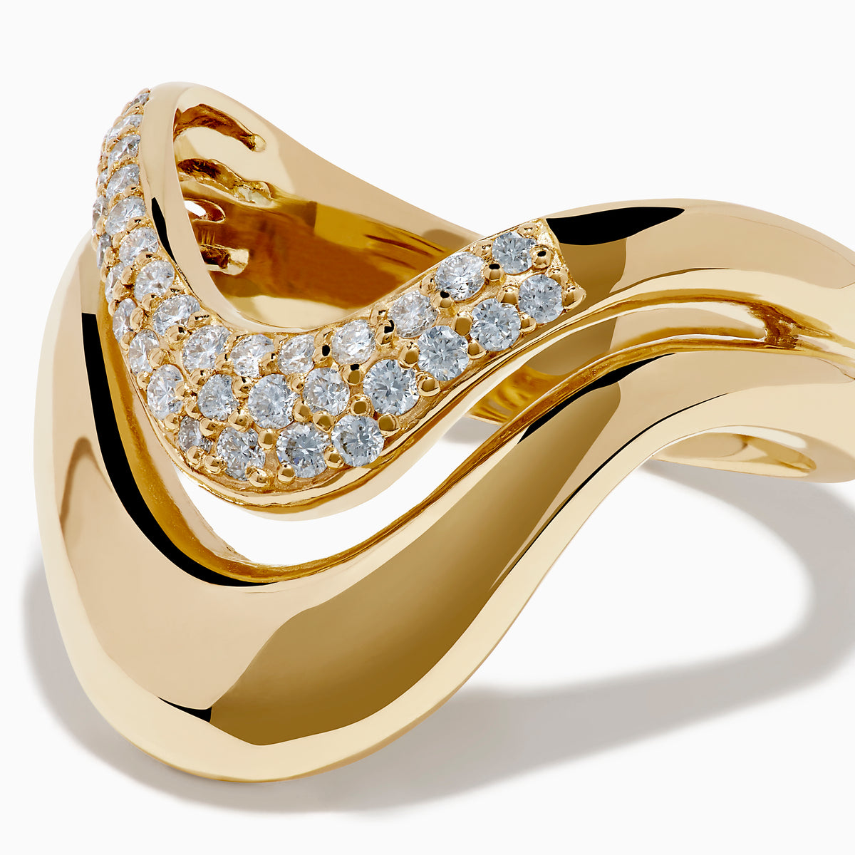 The 14K Yellow Gold Diamond Sculptural Ribbon Ring features a wavy V-shaped design with a sparkling diamond ribbon band above a polished gold band, creating an elegant two-layer look.