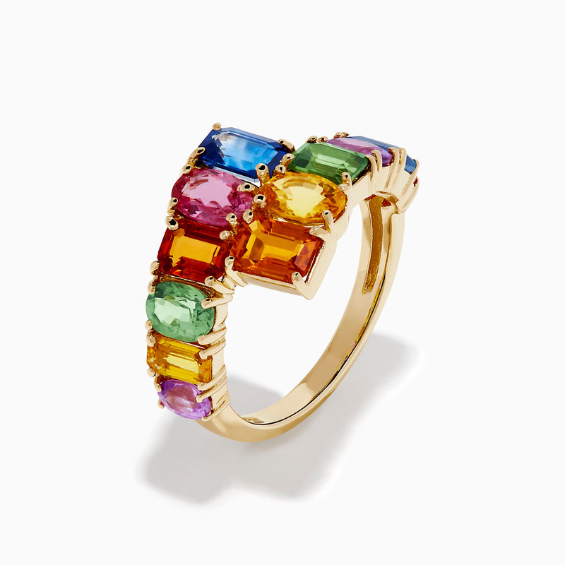 The Watercolors 14K Yellow Gold Multi Sapphire Bypass Ring showcases two rows of vibrant, rectangular sapphires—green, pink, blue, orange, yellow, and purple—in a staggered open-ended design.