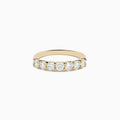The DOro 14K Yellow Gold Round Brilliant Diamond Band 1.03 TCW showcases a row of sparkling round brilliant diamonds on a sleek yellow gold band, displayed against a plain white background.
