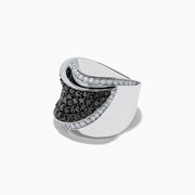 The 14K White Gold Black and White Diamond Ring features a wide, curved design with black and white diamonds at the center, bordered by clear stones along the edges, all set against a white background.