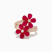 The Ruby Royale 14K Rose Gold Ruby and Diamond Floral Ring features two ruby flower motifs with diamond centers and a diamond-accented band, displayed on a white background.