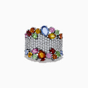 The Watercolors 14K White Gold Multi Sapphire and Diamond Ring features rows of clear diamonds bordered by clusters of vibrant blue, red, green, yellow, orange, and pink oval sapphires.