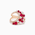 The Ruby Royale 14K Rose Gold Ruby and Diamond Wave Ring features a heart-shaped open design with clusters of round red rubies and sparkling white diamonds set along the band in elegant floral patterns.
