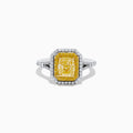 The Canare` 18K Two Tone Gold Yellow and White Diamond Ring features a radiant-cut yellow diamond center, framed by a double halo of white and yellow diamonds on a two-tone gold band.