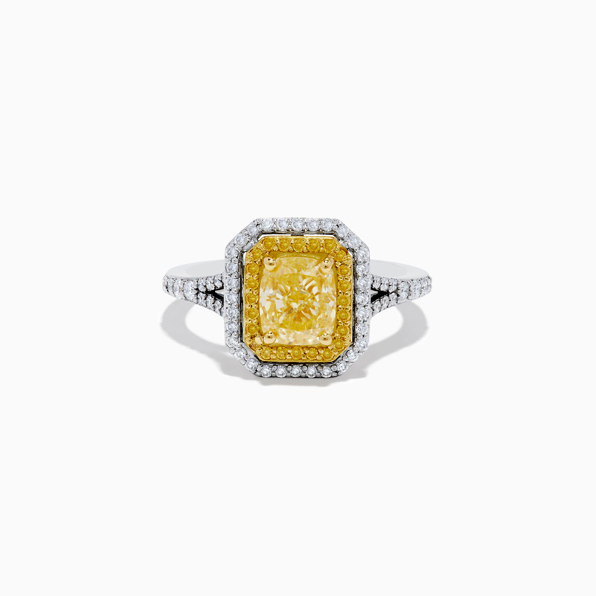 The Canare` 18K Two Tone Gold Yellow and White Diamond Ring features a radiant-cut yellow diamond center, framed by a double halo of white and yellow diamonds on a two-tone gold band.