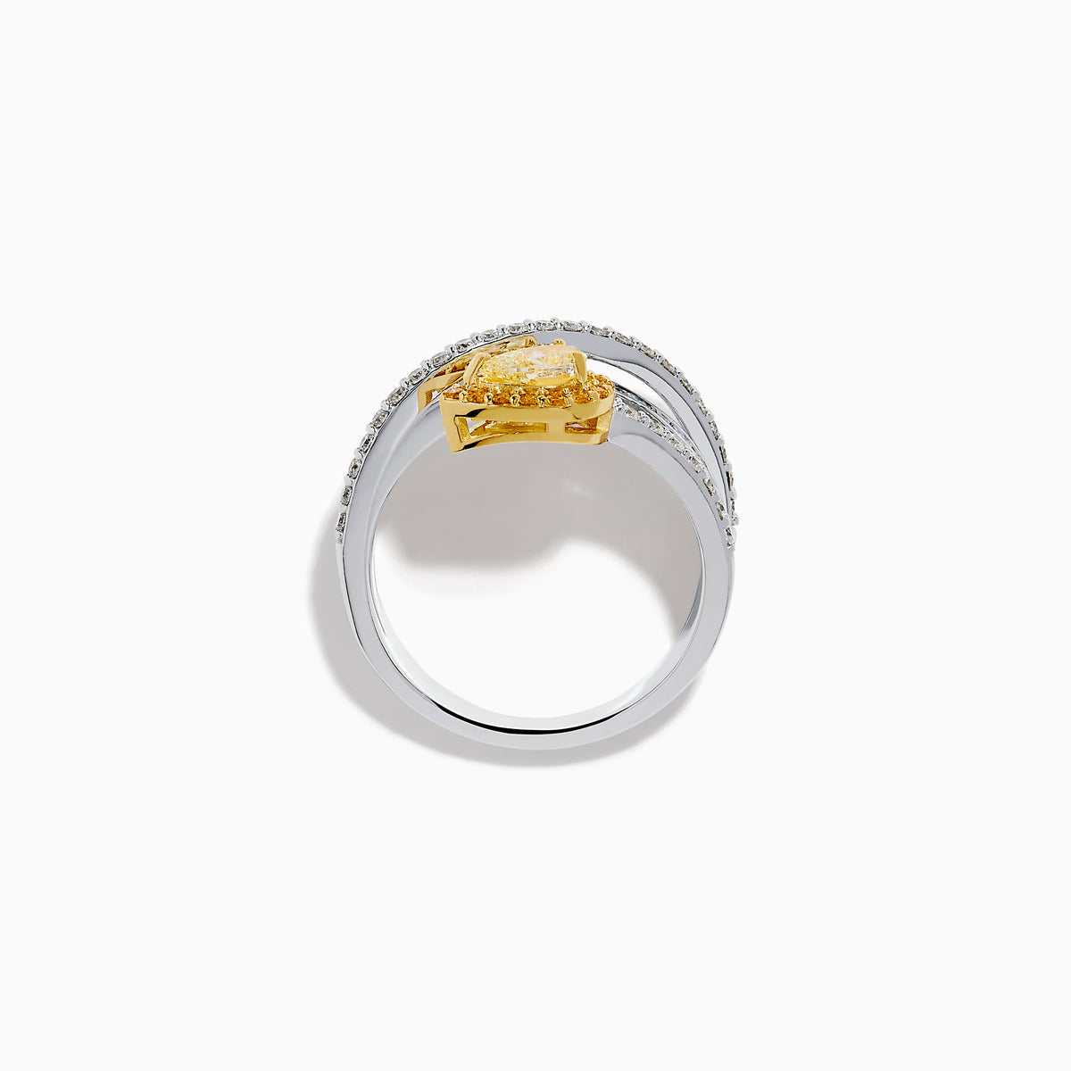 The 18K Two-Tone Gold White and Yellow Diamond Crossover Bypass Ring showcases overlapping diamond bands, a large pear-shaped yellow diamond at the center, and smaller yellow diamonds for a striking two-tone effect.