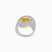 The 18K Two-Tone Gold White and Yellow Diamond Crossover Bypass Ring showcases overlapping diamond bands, a large pear-shaped yellow diamond at the center, and smaller yellow diamonds for a striking two-tone effect.