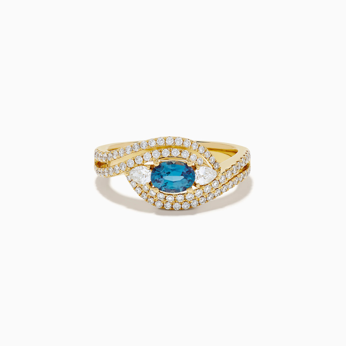 The 18K Yellow Gold Alexandrite and Diamond Swirl Halo Ring features a central oval blue alexandrite, two marquise-cut diamonds, and rows of small round diamonds in an eye-shaped swirl design.