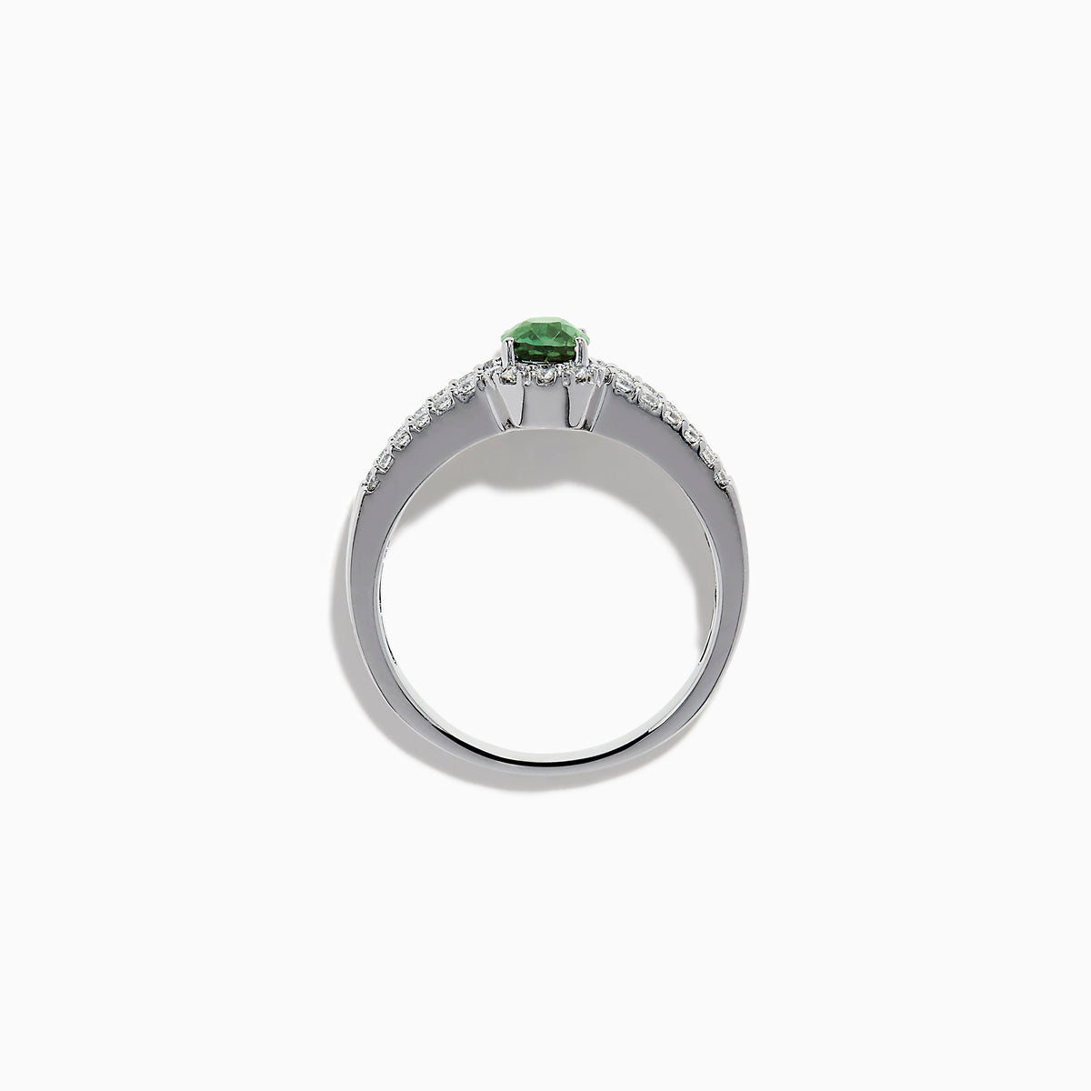 The 18K White Gold Alexandrite and Diamond Split Halo Ring showcases a central oval green Alexandrite, surrounded by a diamond halo with additional diamonds set along the band.