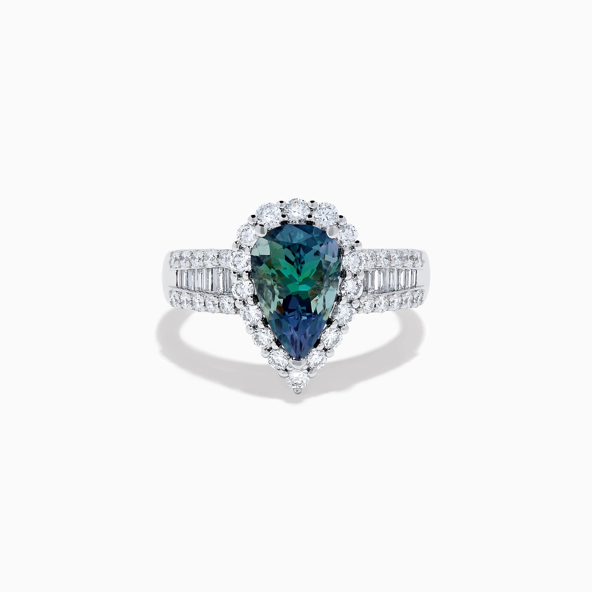 The 18K White Gold GIA Certified Pear Zoisite and Diamond Ring showcases a striking blue-green gemstone accented by round diamonds, with more diamonds along the band for extra brilliance and certified authenticity.