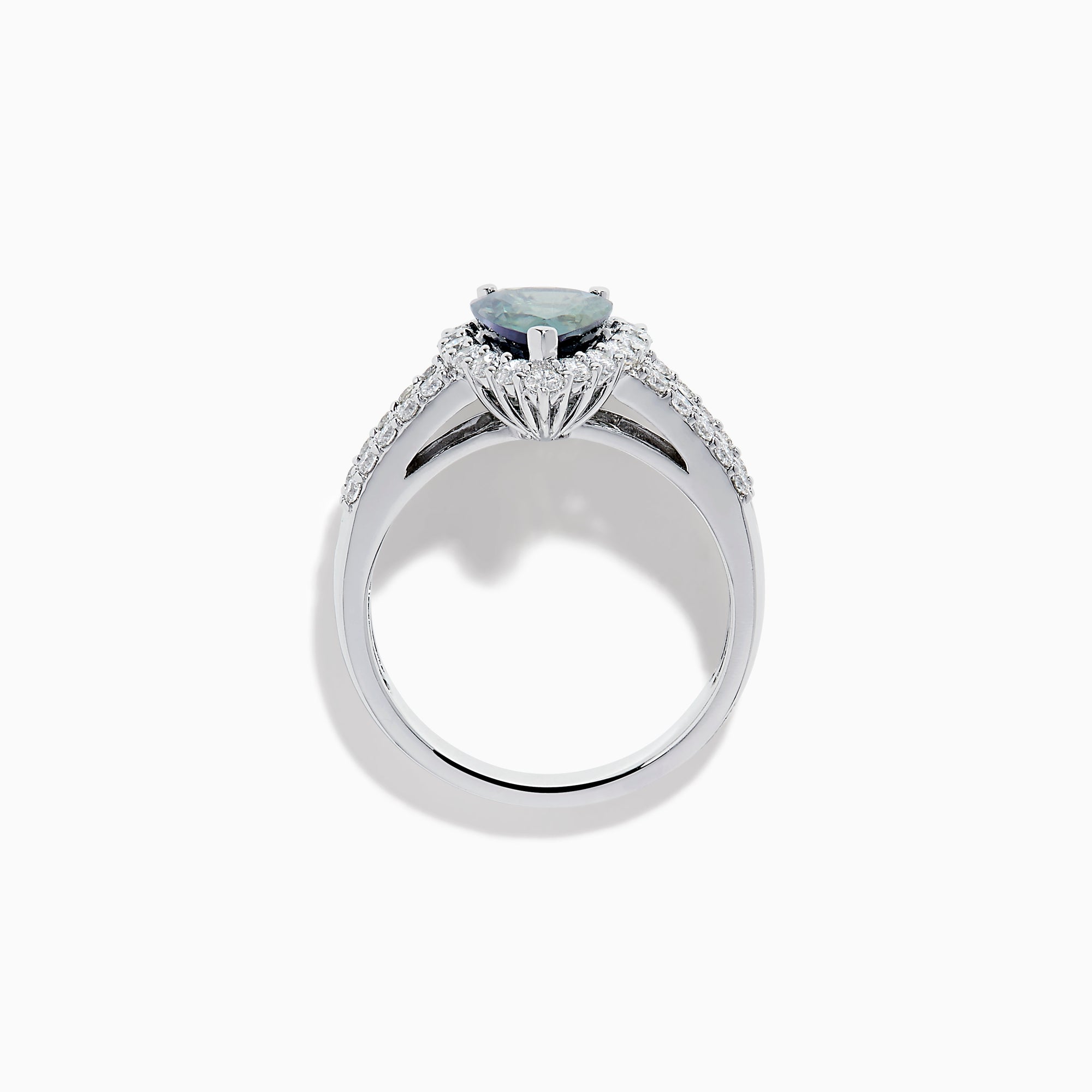 The 18K White Gold GIA Certified Pear Zoisite and Diamond Ring showcases a striking blue-green gemstone accented by round diamonds, with more diamonds along the band for extra brilliance and certified authenticity.