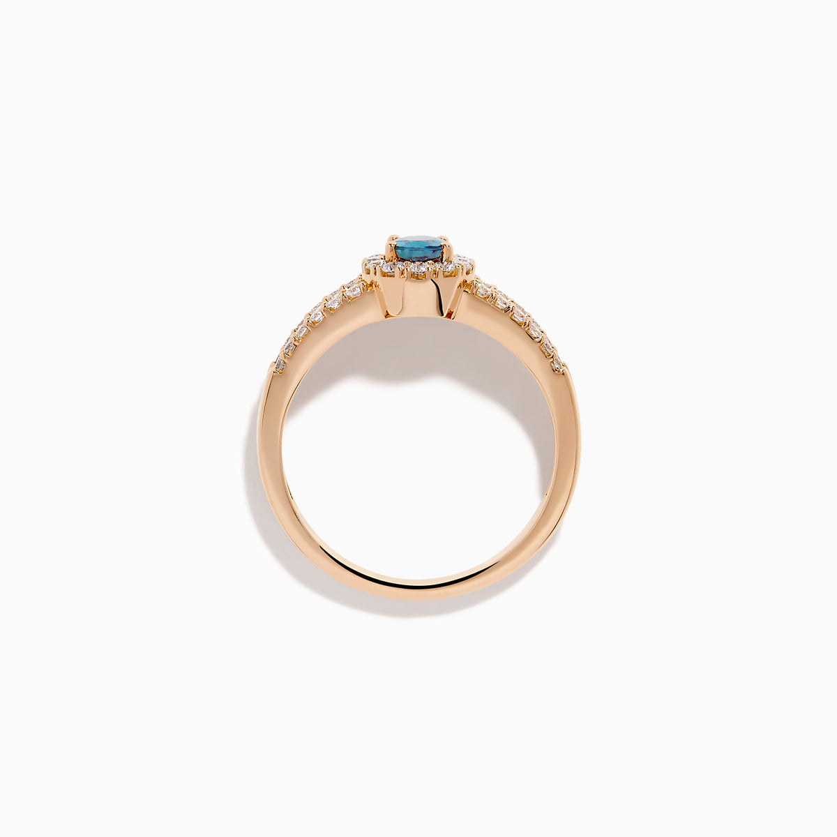 The 18K Rose Gold IGI Certified Alexandrite and Diamond Ring features an oval alexandrite center, a halo of white diamonds, and diamond-accented rows along the band.