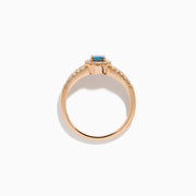 The 18K Rose Gold IGI Certified Alexandrite and Diamond Ring features an oval alexandrite center, a halo of white diamonds, and diamond-accented rows along the band.