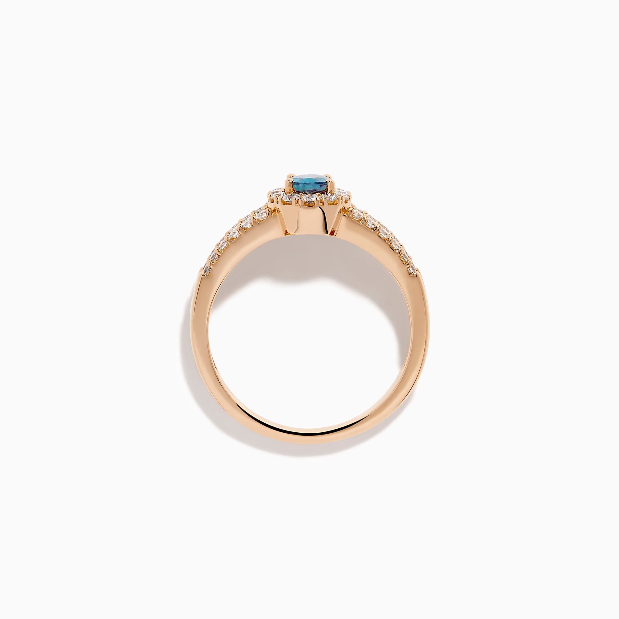 The 18K Rose Gold IGI Certified Alexandrite and Diamond Ring features an oval alexandrite center, a halo of white diamonds, and diamond-accented rows along the band.