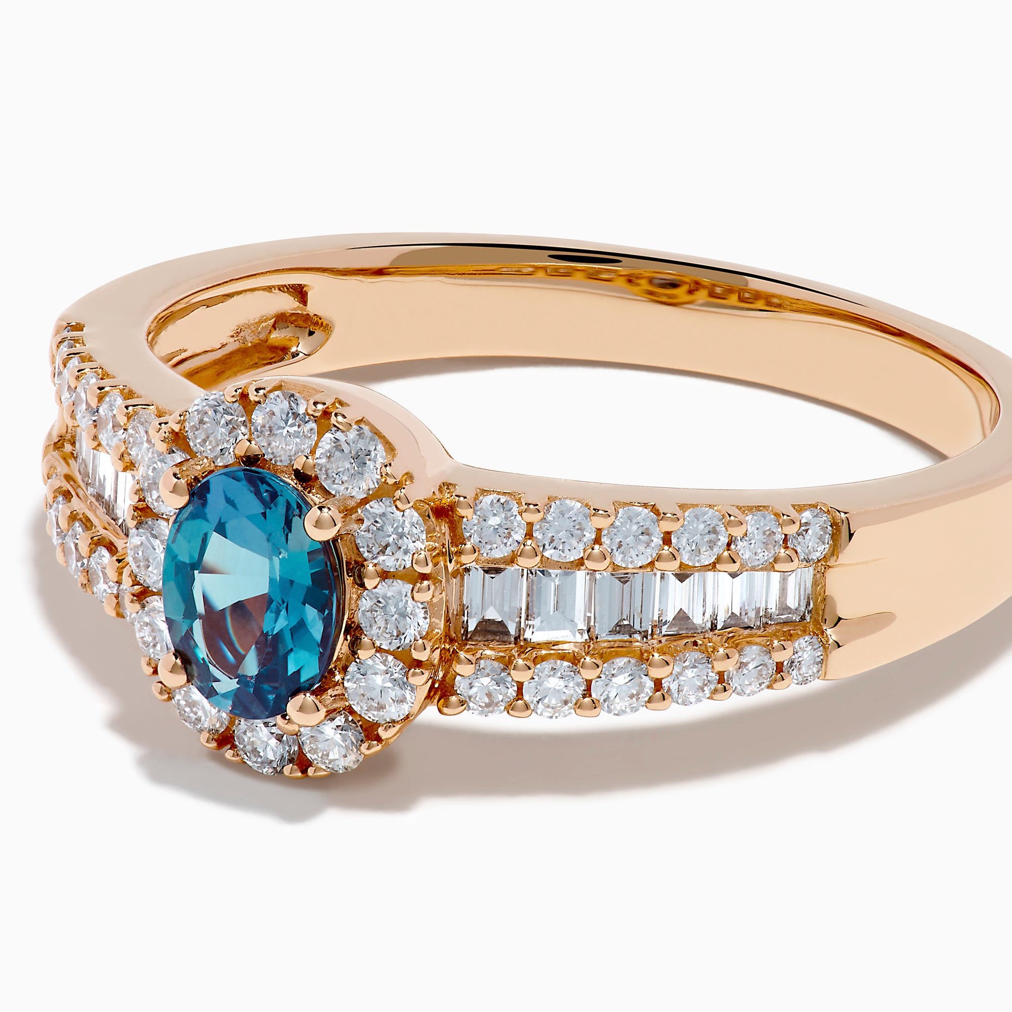The 18K Rose Gold IGI Certified Alexandrite and Diamond Ring features an oval alexandrite center, a halo of white diamonds, and diamond-accented rows along the band.
