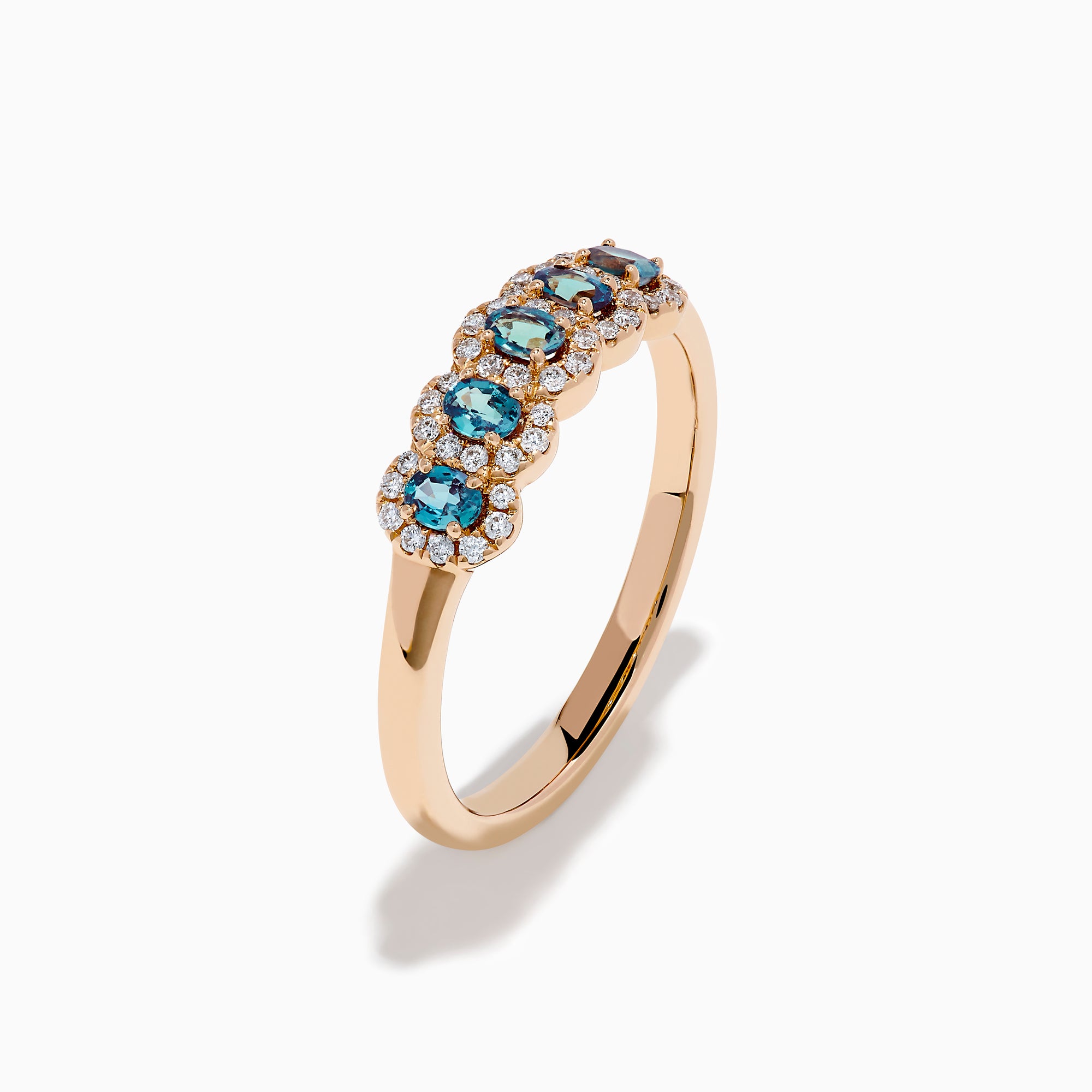 The 18K Rose Gold Alexandrite and Diamond Ring features five oval alexandrites, each encircled by sparkling white diamonds, showcased against a white background.
