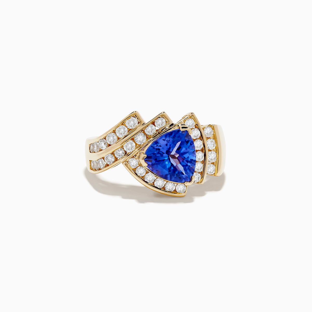 The Nahla Siri 14K Yellow Gold Tanzanite and Diamond Ring showcases a pear-shaped blue tanzanite center, accented by rows of sparkling diamonds set in an elegant, intricate gold band.