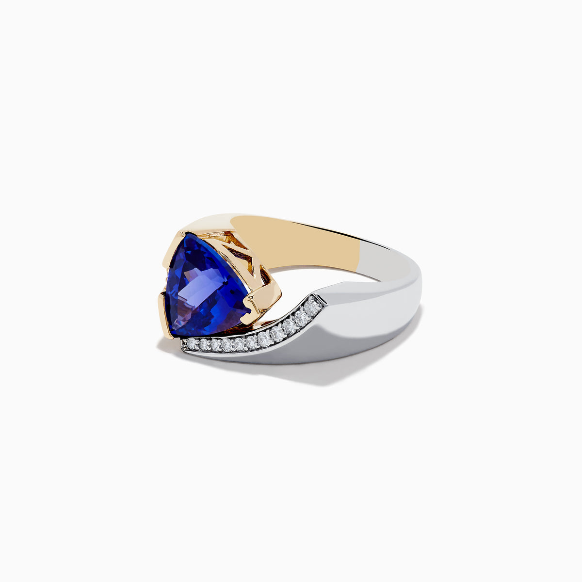 The Nahla Siri 14K Two-Tone Gold Tanzanite and Diamond Ring showcases a striking triangular blue tanzanite accented by a curved row of sparkling white diamonds on one side.